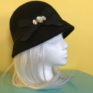 cloche bedazzled bow hat.